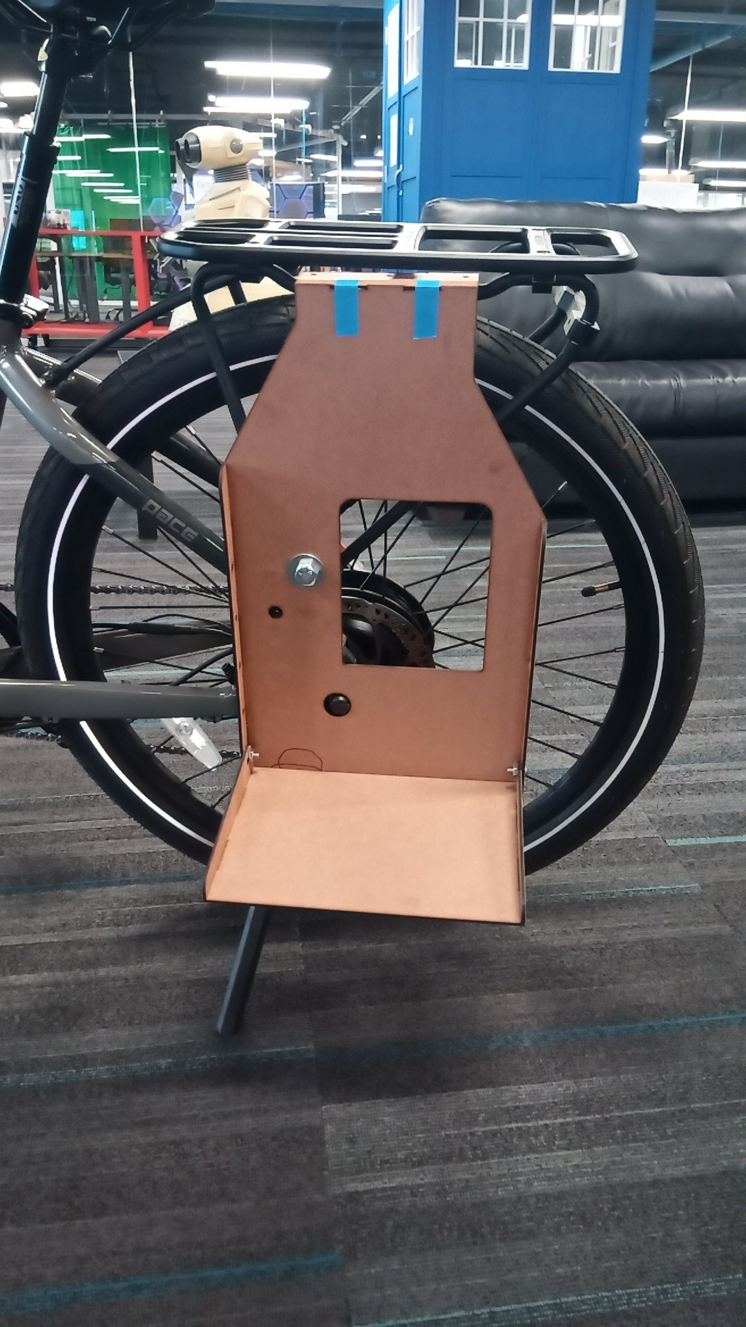 Plywood prototype installed on bike — front view
