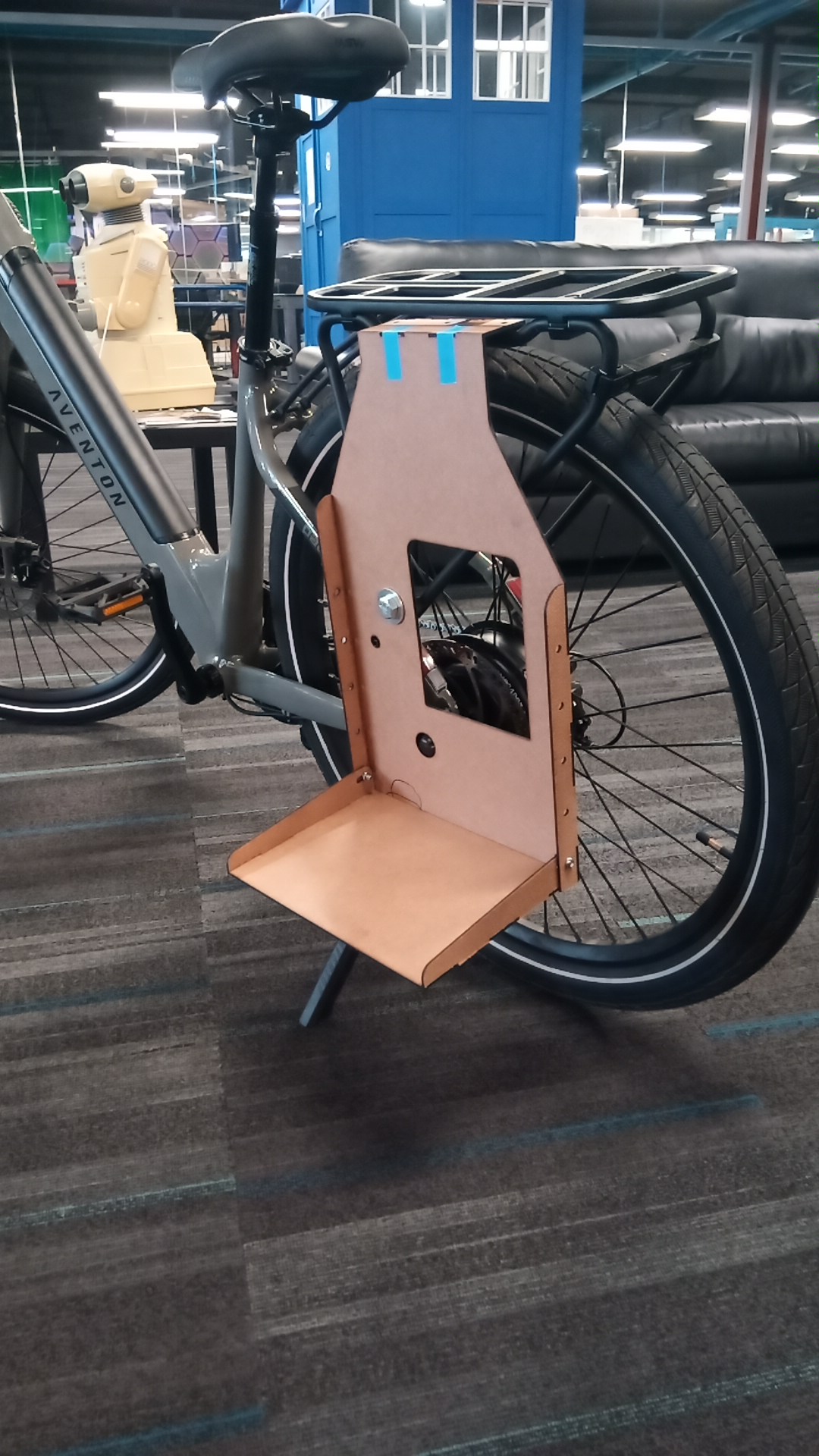 Plywood prototype installed on bike — side view